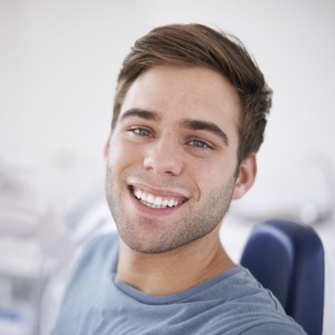 Close up of man in dental chair smiling
