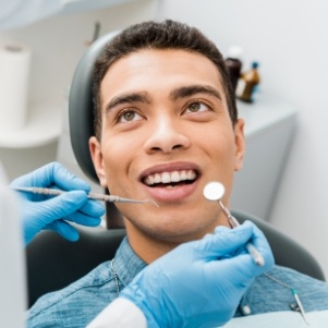 Man sitting in dental chair for dental checkup