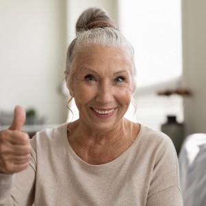 Senior woman giving a thumbs up