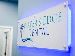 Sign saying Waters Edge Dental on wall