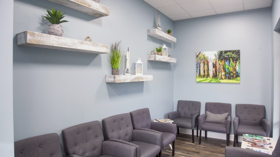 Waiting room with grey chairs