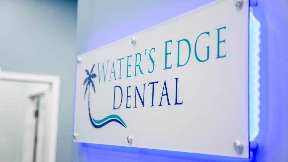 Waters Edge Dental sign on wall