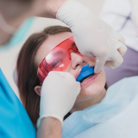 Little girl receiving fluoride treatment