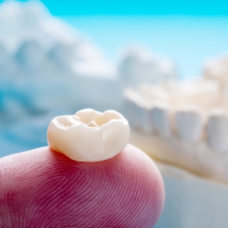 Crown for restorative dentistry in Port Orange on finger